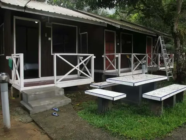 Aguna Resort chalet verandas with white railings and outdoor tables