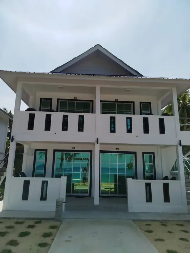 White two-storey Idaman deluxe accommodation building with balconies