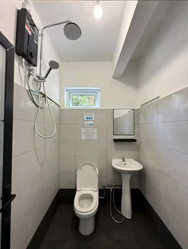 Shared hot-water shower facilities for dorm guests