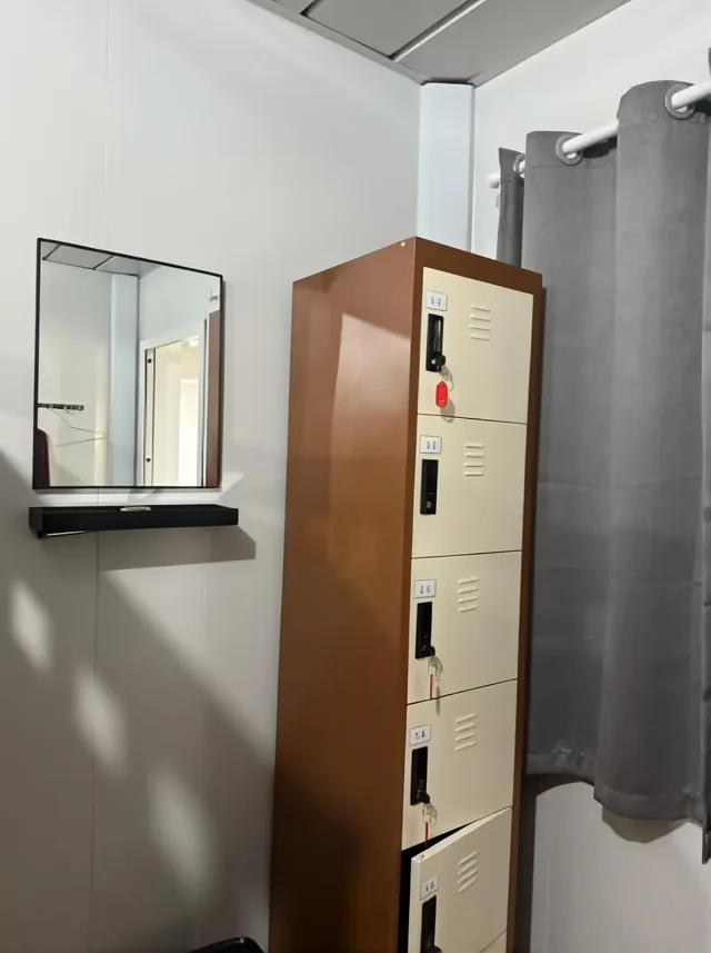 Personal lockers and mirrors in the resort dorm room